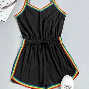 Cute black romper with rainbow trim
